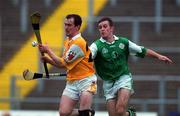 19 June 1999; Alastair Elliot of Antrim in action against Liam Barron of London during the Ulster Senior Championship Hurling Semi-Final match between Antrim and London at Casement Park in Belfast. Photo by David Maher/Sportsfile