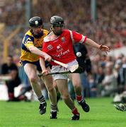 4 July 1999; Ben O'Connor of Cork in action against Frank Lohan of Clare during the Munster Senior Hurling Championship Final match between Cork and Clare at Semple Stadium in Thurles, Tipperary. Photo by Damien Eagers/Sportsfile