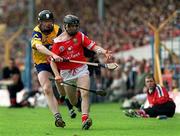 4 July 1999; Ben O'Connor of Cork in action against Frank Lohan of Clare during the Munster Senior Hurling Championship Final match between Cork and Clare at Semple Stadium in Thurles, Tipperary. Photo by Damien Eagers/Sportsfile