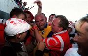 4 July 1999; Brian Corcoran of Cork is congratulated by fans following the Munster Senior Hurling Championship Final match between Cork and Clare at Semple Stadium in Thurles, Tipperary. Photo by Damien Eagers/Sportsfile