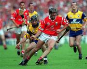4 July 1999; Brian Corcoran of Cork in action against David Forde of Clare during the Munster Senior Hurling Championship Final match between Cork and Clare at Semple Stadium in Thurles, Tipperary. Photo by Brendan Moran/Sportsfile