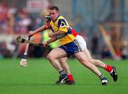 4 July 1999; Colin Lynch of Clare in action against Neil Ronan of Cork during the Munster Senior Hurling Championship Final match between Cork and Clare at Semple Stadium in Thurles, Tipperary. Photo by Brendan Moran/Sportsfile