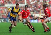 4 July 1999; Colin Lynch of Clare, in action against Neil Ronan, centre, and Michael O'Connell, right, of Cork during the Munster Senior Hurling Championship Final match between Cork and Clare at Semple Stadium in Thurles, Tipperary. Photo by Brendan Moran/Sportsfile