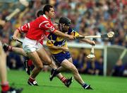 4 July 1999; David Forde of Clare in action against Seán Óg Ó hAilpín of Cork during the Munster Senior Hurling Championship Final match between Cork and Clare at Semple Stadium in Thurles, Tipperary. Photo by Brendan Moran/Sportsfile