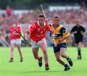 4 July 1999; Fergal Ryan of Cork in action against Alan Markham of Clare during the Munster Senior Hurling Championship Final match between Cork and Clare at Semple Stadium in Thurles, Tipperary. Photo by Damien Eagers/Sportsfile