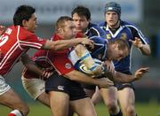 14 April 2006; Keith Gleeson, Leinster, is tackled by Craig Dunlea and Regan King, 12, Llanelli Scarlets. Celtic League 2005-2006, Group A, Leinster v Llanelli Scarlets, Lansdowne Road, Dublin. Picture credit: Matt Browne / SPORTSFILE