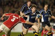14 April 2006; Gordon D'Arcy, Leinster, is tackled by Craig Dunlea, Llanelli Scarlets. Celtic League 2005-2006, Group A, Leinster v Llanelli Scarlets, Lansdowne Road, Dublin. Picture credit: Matt Browne / SPORTSFILE