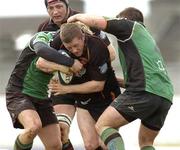 15 April 2006; Steve Jones, Newport Gwent Dragons, is tackled by Paul Warwick, left, and John Fogarty, Connacht. Celtic League 2005-2006, Group A, Connacht v Newport Gwent Dragons, Sportsground, Galway. Picture credit: Matt Browne / SPORTSFILE