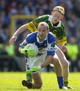 16 April 2006; Tom Kelly, Laois, in action against Colm Cooper, Kerry. Allianz National Football League, Division 1 Semi-Final, Kerry v Laois, Fitzgerald Stadium, Killarney, Co. Kerry. Picture credit: Brendan Moran / SPORTSFILE