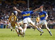 23 April 2006; Hugh Moloney, Tipperary, makes a diving attempt to stop Eoin Larkin, Kilkenny. Allianz National Hurling League, Division 1 Semi-Final, Kilkenny v Tipperary, Semple Stadium, Thurles, Co. Tipperary. Picture credit: Ray McManus / SPORTSFILE