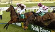 27 April 2006; Accordion Etoile, number 1, with John Cullen up, jumps the last on their way to winning, the Swordlestown Cup Novice Chase from, Justified, with Tony McCoy. Punchestown Racecourse, Co. Kildare. Picture credit: Matt Browne / SPORTSFILE