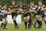 29 April 2006; Darragh Payne, Young Munster, is tackled by Scott Hutton, right and Chris Kennedy, left, Old Belvedere. AIB League, Division 2. Young Munster v Old Belvedere, Anglesea Road, Dublin. Picture credit: David Levingstone / SPORTSFILE