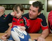 11 May 2006; Munster's Anthony Foley signs an autograph for fan Evan Lacey after a squad training session. Thomond Park, Limerick. Picture credit: Kieran Clancy / SPORTSFILE