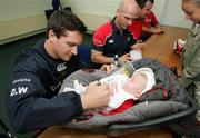 11 May 2006; Munster's David Wallace signs an autograph for eight week old Katie Wallace. Thomond Park, Limerick. Picture credit: Kieran Clancy / SPORTSFILE