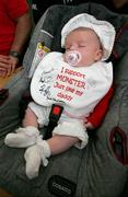 11 May 2006; Eight week old Katie Clohessy, from Glendale, Co. Limerick, has her bib signed by players from the Munster squad. Thomond Park, Limerick. Picture credit: Kieran Clancy / SPORTSFILE