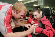 11 May 2006; Munster's Paul O'Connell signs an autograph for fan Wayne Daly after a squad training session. Thomond Park, Limerick. Picture credit: Kieran Clancy / SPORTSFILE