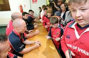 11 May 2006; Munster players Peter Stringer, John Hayes and David Wallace sign autographs for their fans after a squad training session. Thomond Park, Limerick. Picture credit: Kieran Clancy / SPORTSFILE