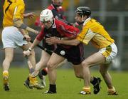 14 May 2006; Stephen Clarke, Down, is tackled by Ciaran Herron, Antrim. Guinness Ulster Senior Hurling Championship Semi-Final, Down v Antrim, Casement Park, Belfast. Picture credit; Pat Murphy / SPORTSFILE