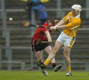 14 May 2006; Darren Hamill, Antrim, is tackled by Tomas Harte, Down. Guinness Ulster Senior Hurling Championship Semi-Final, Down v Antrim, Casement Park, Belfast. Picture credit; Pat Murphy / SPORTSFILE