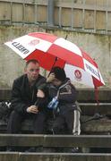 14 May 2006; Supporters watch the game despite the weather. Guinness Ulster Senior Hurling Championship Semi-Final, Down v Antrim, Casement Park, Belfast. Picture credit; Pat Murphy / SPORTSFILE