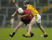 14 May 2006; Stephen Clarke, Down, is tackled by Ciaran Herron, Antrim. Guinness Ulster Senior Hurling Championship Semi-Final, Down v Antrim, Casement Park, Belfast. Picture credit; Pat Murphy / SPORTSFILE