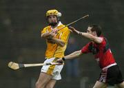14 May 2006; Conor Cunning, Antrim, is tackled by Ciaran Coulter, Down. Guinness Ulster Senior Hurling Championship Semi-Final, Down v Antrim, Casement Park, Belfast. Picture credit; Pat Murphy / SPORTSFILE