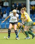 19 May 2006; Catriona Carey, Hermes, in action against Ciara O'Brien, Railway Union. ESB Club Championship, Hermes v Railway Union, National Hockey Stadium, UCD, Belfield, Dublin. Picture credit; David Levingstone / SPORTSFILE