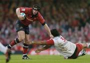 20 May 2006; Denis Leamy, Munster, is tackled by Census Johnson, Biarritz. Heineken Cup Final, Munster v Biarritz Olympique, Millennium Stadium, Cardiff, Wales. Picture credit; Brendan Moran / SPORTSFILE