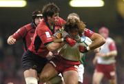 20 May 2006; Donncha O'Callaghan, Munster, tackles Jean-Baptiste Gobelet, Biarritz.  Heineken Cup final, Munster v Biarritz Olympique, Millennium Stadium, Cardiff, Wales. Picture credit; Brian Lawless / SPORTSFILE