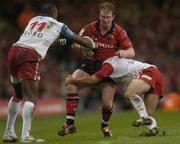 20 May 2006; Anthony Horgan, Munster, is tackled by Sereli Bobo, left, and Philippe Bidabe, Biarritz. Heineken Cup final, Munster v Biarritz Olympique, Millennium Stadium, Cardiff, Wales. Picture credit; Brian Lawless / SPORTSFILE