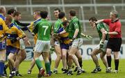 21 May 2006; Referee Pat Sheehy attempts to hold back Limerick and Clare players. Bank of Ireland Munster Senior Football Championship, Quarter-final, Limerick v Clare, Gaelic Grounds, Limerick. Picture credit; Damien Eagers / SPORTSFILE