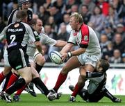 26 May 2006; Roger Wilson, Ulster, is tackled by Jason Spice, Neath Swansea Ospreys. Celtic League 2005-2006, Neath Swansea Ospreys v Ulster, Liberty Stadium, Swansea, Wales. Picture credit: Oliver McVeigh / SPORTSFILE