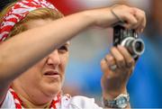 8 June 2014; Lorraine Burns, from Ardee, Co. Louth, attempts to take a photograph of her son, Louth player Ryan Burns, during the game. Leinster GAA Football Senior Championship, Quarter-Final, Louth v Kildare, Croke Park, Dublin.  Picture credit: Brendan Moran / SPORTSFILE