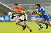 21 May 2006; Patrick Hickey, Carlow, in action against Kevin Manning and Ken Kelly, Wicklow. Bank of Ireland Leinster Senior Football Championship, Round 1, Wicklow v Carlow, Wexford Park, Co. Wexford. Picture credit; Matt Browne / SPORTSFILE