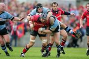 27 May 2006; Trevor Hogan, Munster, is tackled by Robin Sowden-Taylor and John Yapp, Cardiff Blues. Celtic League 2005-2006, Munster v Cardiff Blues, Thomond Park, Limerick. Picture credit: Kieran Clancy / SPORTSFILE