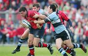 27 May 2006; Denis Leamy, Munster, is tackled by Marc Stcherbina and David Flanagan, Cardiff Blues. Celtic League 2005-2006, Munster v Cardiff Blues, Thomond Park, Limerick. Picture credit: Kieran Clancy / SPORTSFILE