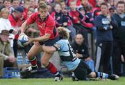 27 May 2006; Shaun Payne, Munster, is tackled by Jamie Robinson, Cardiff Blues. Celtic League 2005-2006, Munster v Cardiff Blues, Thomond Park, Limerick. Picture credit: Kieran Clancy / SPORTSFILE