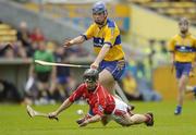 28 May 2006; Rory Doherty, Cork, in action against James McInerney, Clare. Munster Intermediate Hurling Championship, Semi-final, Clare v Cork, Semple Stadium, Thurles, Co. Tipperary. Picture credit; Brendan Moran / SPORTSFILE