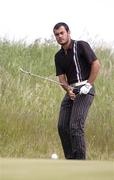 4 June 2006; Hugo Leon, Chile, watches his putt on the 11th hole during the East of Ireland Amateur Open Championship. Co. Louth Golf Club, Baltray, Co. Louth. Picture credit: Ray Lohan / SPORTSFILE