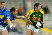 11 June 2006; Eoin Brosnan, Kerry, is tackled by Brian Lacey, Tipperary. Bank of Ireland Munster Senior Football Championship, Semi-Final, Kerry v Tipperary, Fitzgerald Stadium, Killarney, Co. Kerry. Picture credit: Brendan Moran / SPORTSFILE