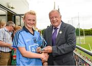 15 May 2014; Pat Quill, President of the Ladies Gaelic Football Association presents player of the match Carla Rowe with her award. Aisling McGing Ladies U21 Football Final, Dublin v Meath, Clane, Co. Kildare. Picture credit: Piaras Ó Mídheach / SPORTSFILE