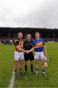 4 May 2014; JJ Delaney, Kilkenny, left, and Brendan Maher, Tipperary, shake hands in front of referee James Owens. Allianz Hurling League Division 1 Final, Tipperary v Kilkenny, Semple Stadium, Thurles, Co. Tipperary. Picture credit: Ray McManus / SPORTSFILE