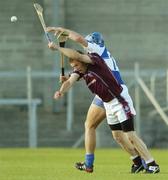 1 July 2006; Christo Murtagh, Westmeath, in action against Mark Rooney, Laois. Guinness All-Ireland Senior Hurling Championship Qualifier, Round 2, Westmeath v Laois, Cusack Park, Mullingar, Co. Westmeath. Picture credit: Damien Eagers / SPORTSFILE