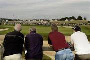 6 July 2006; Members of the crowd watch the golf at the 16th green during the Kappa Smurfit European Open Golf Championship. K Club, Straffan, Co. Kildare. Picture credit: Damien Eagers / SPORTSFILE