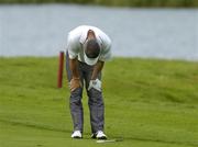 6 July 2006; Paul McGinley reacts after he put his second shot into the water on the 16th hole during the Kappa Smurfit European Open Golf Championship. K Club, Straffan, Co. Kildare. Picture credit: Matt Browne / SPORTSFILE