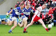 8 July 2006; Darren Rooney and Tom Kelly, Laois, in action against Colm McCullagh, Tyrone. Bank of Ireland All-Ireland Senior Football Championship Qualifier, Round 2, Laois v Tyrone, O'Moore Park, Portlaoise, Co. Laois. Picture credit: Oliver McVeigh / SPORTSFILE