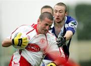8 July 2006; Billy Sheehan, Laois, in action against Stephen O'Neill, Tyrone. Bank of Ireland All-Ireland Senior Football Championship Qualifier, Round 2, Laois v Tyrone, O'Moore Park, Portlaoise, Co. Laois. Picture credit: Oliver McVeigh / SPORTSFILE