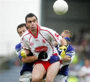 8 July 2006; Padraig McMahon, Laois, in action against Ryan McMenamin, Tyrone. Bank of Ireland All-Ireland Senior Football Championship Qualifier, Round 2, Laois v Tyrone, O'Moore Park, Portlaoise, Co. Laois. Picture credit: Oliver McVeigh / SPORTSFILE