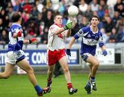 8 July 2006; Tom Kelly and Brendan Quigley, Laois, in action against Philip Jordan, Tyrone. Bank of Ireland All-Ireland Senior Football Championship Qualifier, Round 2, Laois v Tyrone, O'Moore Park, Portlaoise, Co. Laois. Picture credit: Oliver McVeigh / SPORTSFILE