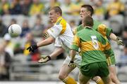 9 July 2006; Justin Crozier, Antrim, in action against Paul McGinley, 5, and Leo McLoone, Donegal. ESB Ulster Minor Football Championship Final, Donegal v Antrim, Croke Park, Dublin. Picture credit: Pat Murphy / SPORTSFILE